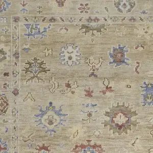 Photo of Tan Brown and Blue Wool Floral Hand Knotted Area Rug With Fringe