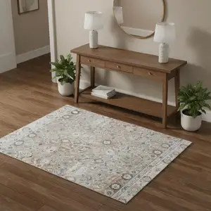 Photo of Tan Floral Distressed Area Rug