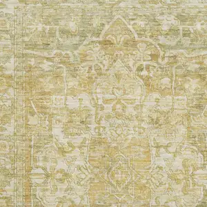 Photo of Tan Gold And Ivory Oriental Washable Area Rug With UV Protection