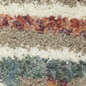 Photo of Tan Gray And Ivory Abstract Shag Distressed Area Rug With Fringe
