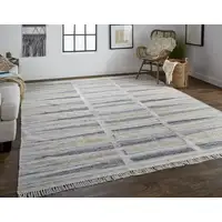 Photo of Tan Gray And Taupe Geometric Hand Woven Stain Resistant Area Rug With Fringe