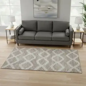 Photo of Tan Ivory And Beige Tribal Washable Area Rug With UV Protection