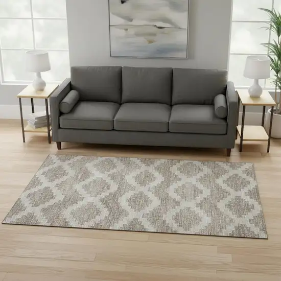 Tan Ivory And Beige Tribal Washable Area Rug With UV Protection Photo 1