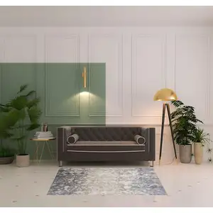 Photo of Tan Ivory And Blue Abstract Power Loom Distressed Area Rug