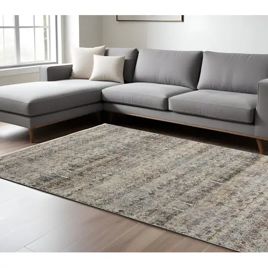 Tan and Ivory Geometric Power Loom Distressed Non Skid Area Rug With Fringe Photo 1