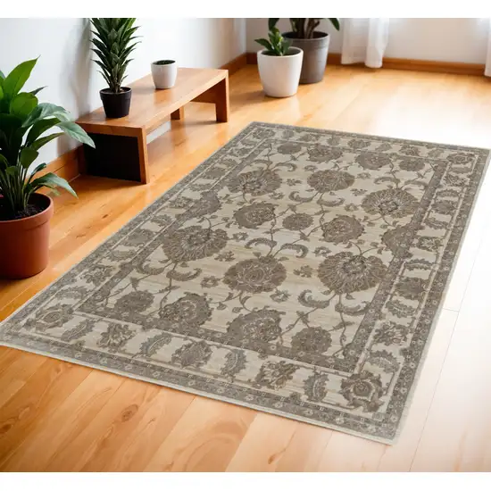 Tan Ivory And Brown Power Loom Area Rug Photo 1
