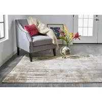 Photo of Tan Ivory And Gray Abstract Area Rug