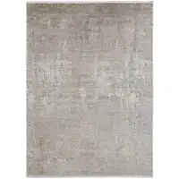 Photo of Tan Ivory And Gray Abstract Power Loom Distressed Area Rug With Fringe
