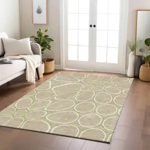 Photo of Tan Ivory And Green Abstract Washable Indoor Outdoor Area Rug