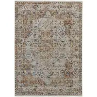 Photo of Tan Ivory And Orange Floral Power Loom Area Rug With Fringe