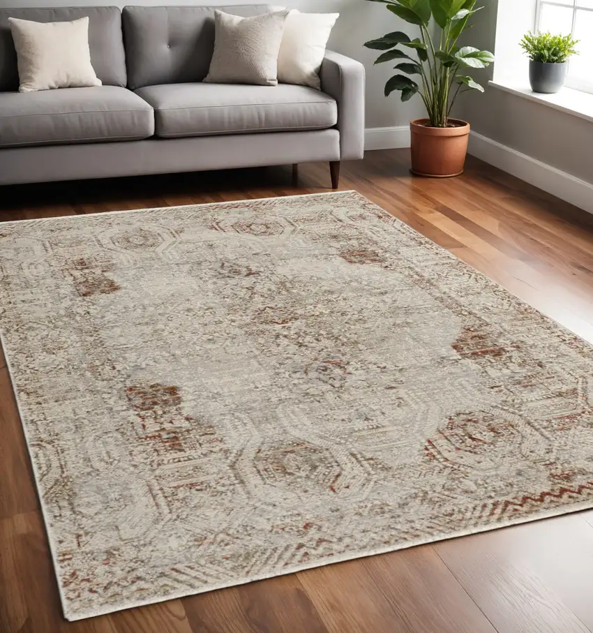 Tan and Ivory Floral Power Loom Distressed Non Skid Area Rug With Fringe Photo 1
