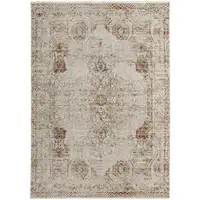 Photo of Tan Ivory And Orange Floral Power Loom Distressed Area Rug With Fringe