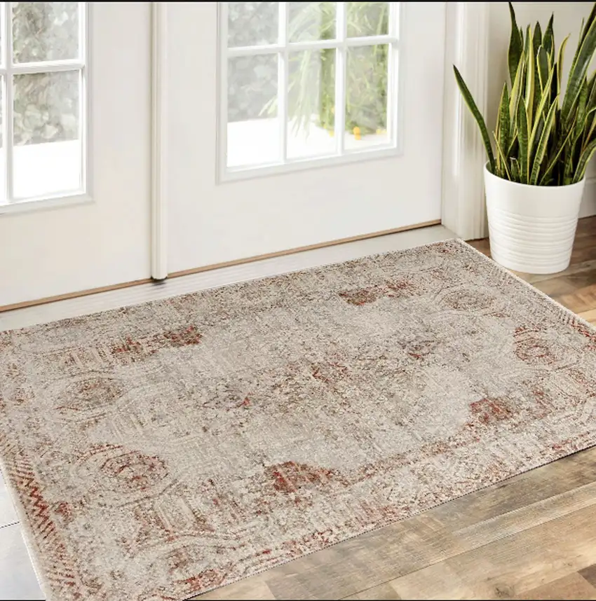 Tan Ivory And Orange Floral Power Loom Distressed Area Rug With Fringe Photo 1
