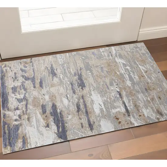 Tan Ivory And Blue Abstract Distressed Area Rug Photo 1