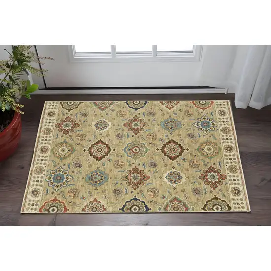 Tan Light Blue And Orange Floral Area Rug With Fringe Photo 1