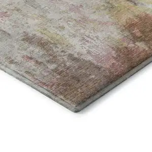 Photo of Tan Mauve And Ivory Abstract Washable Area Rug With UV Protection