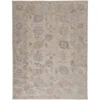 Photo of Tan Orange And Blue Floral Hand Knotted Stain Resistant Area Rug