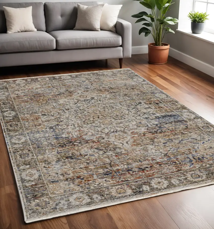 Tan and Blue Floral Power Loom Distressed Non Skid Area Rug With Fringe Photo 1