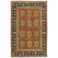 Photo of Tan Orange And Brown Wool Floral Hand Knotted Stain Resistant Area Rug