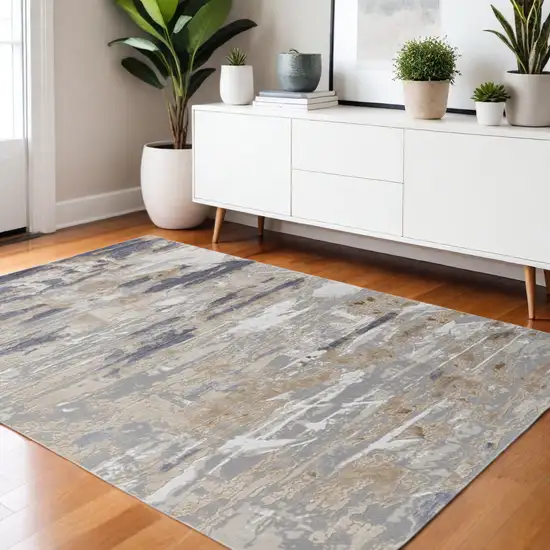 Tan Ivory And Blue Abstract Distressed Area Rug Photo 1