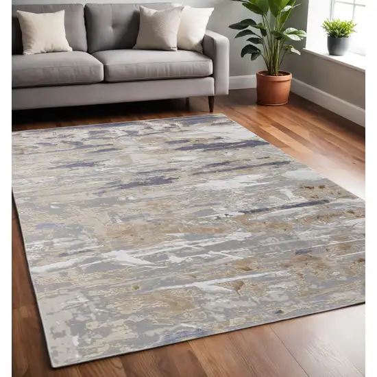 Tan Ivory And Blue Abstract Distressed Area Rug Photo 1