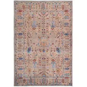 Photo of Tan Pink And Blue Floral Power Loom Area Rug