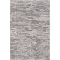 Photo of Tan Taupe And Gray Abstract Power Loom Distressed Stain Resistant Area Rug