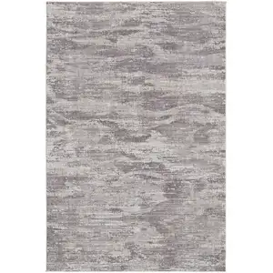 Photo of Tan Taupe And Gray Abstract Power Loom Distressed Stain Resistant Area Rug