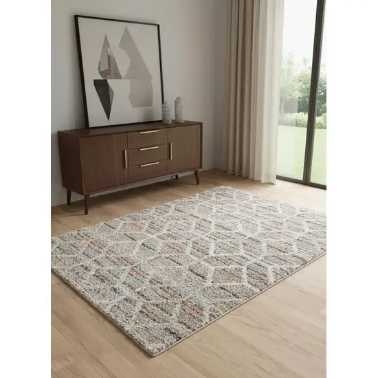 Tan Taupe And Ivory Geometric Power Loom Stain Resistant Area Rug Photo 1