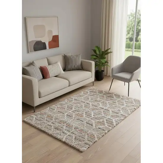 Tan Taupe And Ivory Geometric Power Loom Stain Resistant Area Rug Photo 1