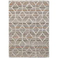 Photo of Tan Taupe And Ivory Geometric Power Loom Stain Resistant Area Rug