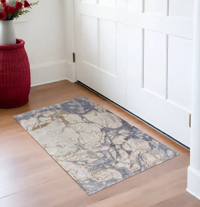 Tan and Blue Abstract Power Loom Worn Faded Area Rug Photo 1