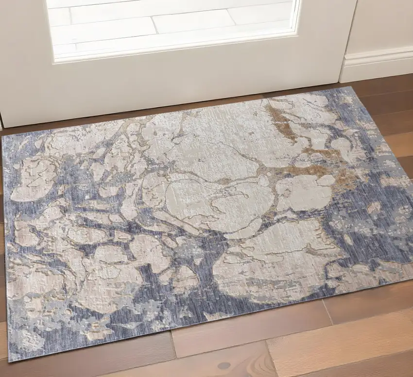 Tan Blue And Beige Abstract Distressed Area Rug Photo 1