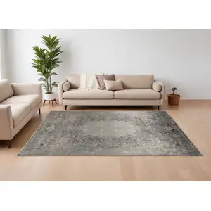 Photo of Tan and Gray Oriental Power Loom Worn Faded Area Rug