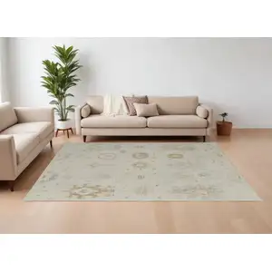 Photo of Tan and Gray Wool Floral Hand Knotted Area Rug
