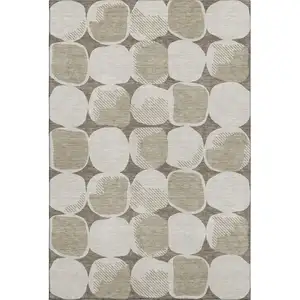 Photo of Taupe And Beige Abstract Geometric Washable Area Rug With UV Protection