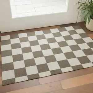 Photo of Taupe And Beige Checkered Washable Area Rug With UV Protection