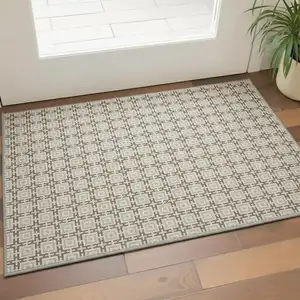 Photo of Taupe And Beige Geometric Washable Area Rug With UV Protection