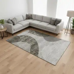 Photo of Taupe And Beige Geometric Washable Area Rug With UV Protection