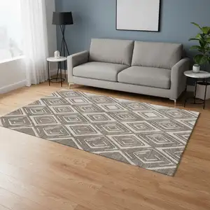 Photo of Taupe And Beige Geometric Washable Area Rug With UV Protection