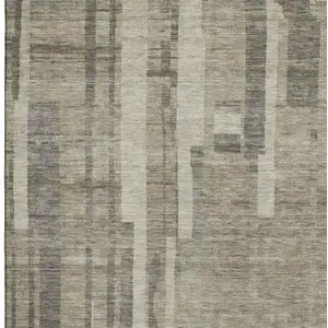 Photo of Taupe And Beige Striped Washable Area Rug With UV Protection