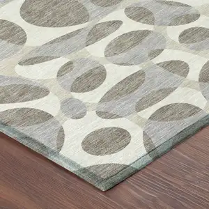 Photo of Taupe And Brown Abstract Washable Indoor Outdoor Area Rug