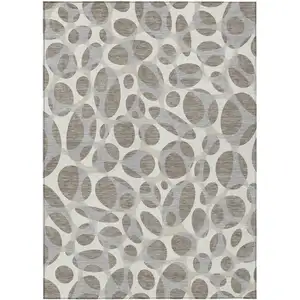 Photo of Taupe And Brown Abstract Washable Indoor Outdoor Area Rug