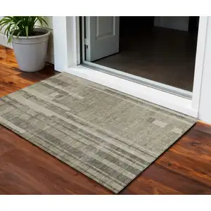 Photo of Taupe And Dark Gray Striped Washable Indoor Outdoor Area Rug