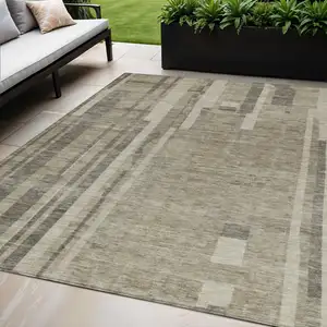 Photo of Taupe And Dark Gray Striped Washable Indoor Outdoor Area Rug