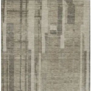 Photo of Taupe And Dark Gray Striped Washable Indoor Outdoor Area Rug