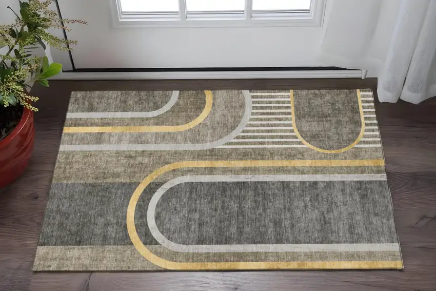Taupe And Gold Geometric Washable Area Rug With UV Protection Photo 2