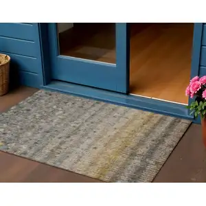 Photo of Taupe And Gold Striped Washable Indoor Outdoor Area Rug