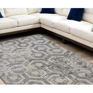 Photo of Taupe And Gray Abstract Distressed Area Rug