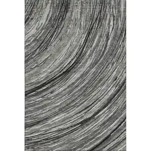 Photo of Taupe And Gray Abstract Washable Area Rug With UV Protection